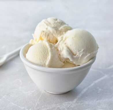 Bowl of vanilla ice cream with topping