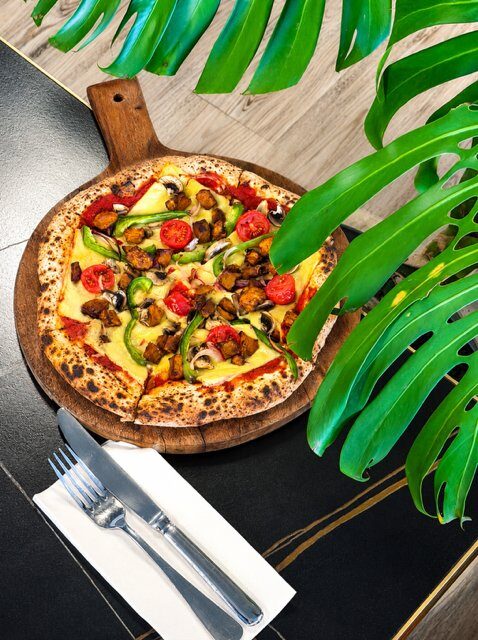 Veggie Supreme pizza with capsicum, mushroom, red onion and spiced pumpkin on gluten free base